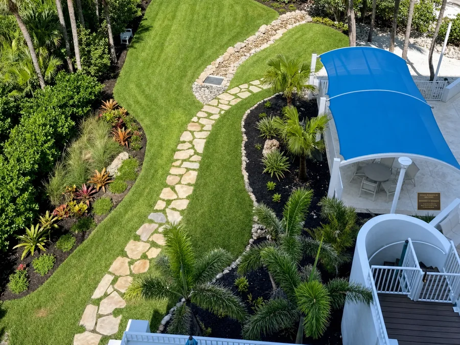 Dry, usable waterfront lawn at a Sarasota condo community after a drainage correction